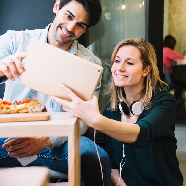 Couple taking picture together in cafe