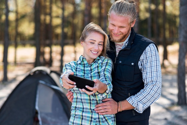 Couple taking a selfie front view