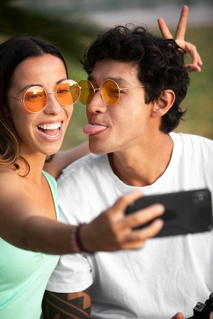 Couple taking a selfie while traveling in summer