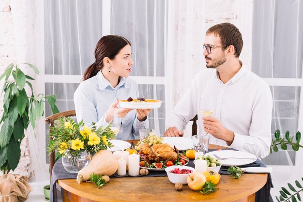 Couple talking at festive table 