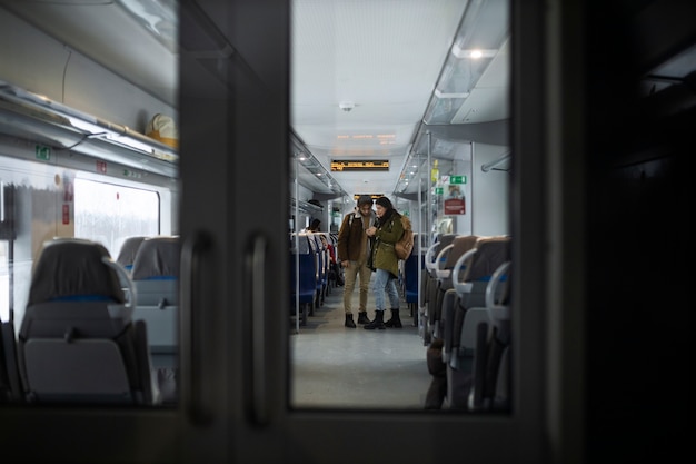 Couple talking while traveling by train