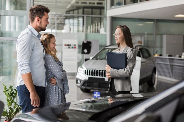 Couple talking with a showroom agent