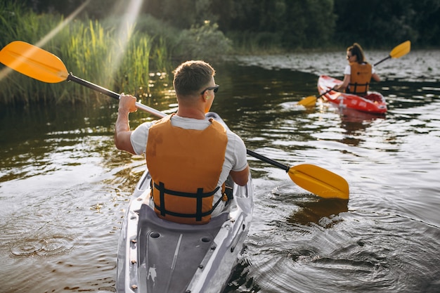 Free photo couple together kayaking on the river