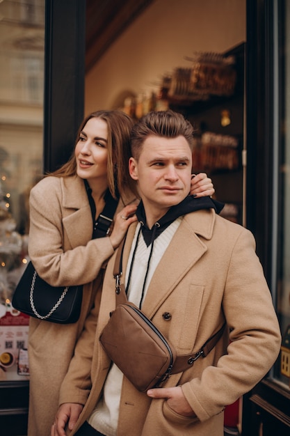 Free photo couple together walking in the street on valentines day