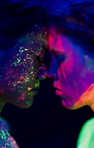 Couple touching foreheads uv paint