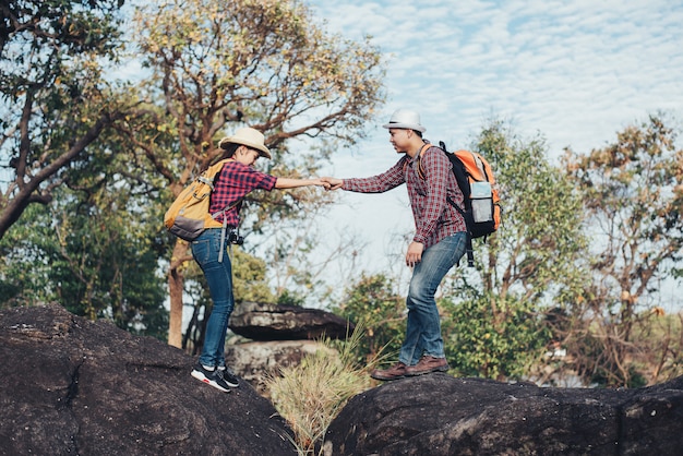 Couple Of Tourists in the forest on mountain