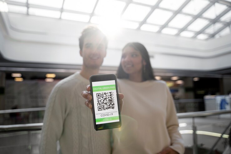 Free Photo couple traveling with vaccination passports