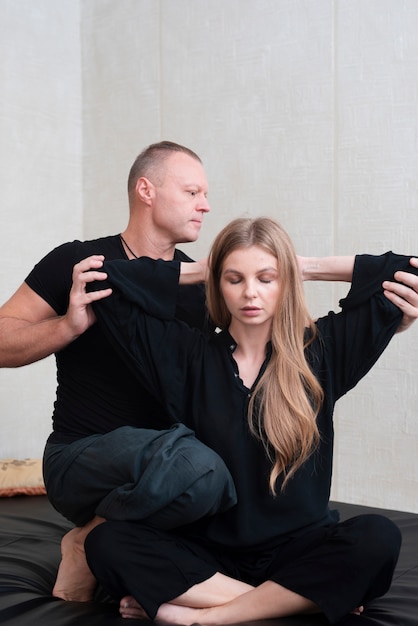 Couple trying body therapy at spa