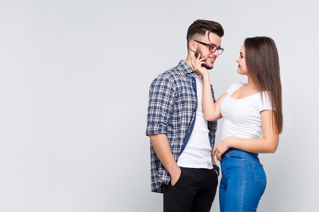 Couple of two lovely person wearing at casual style isolated on white wall