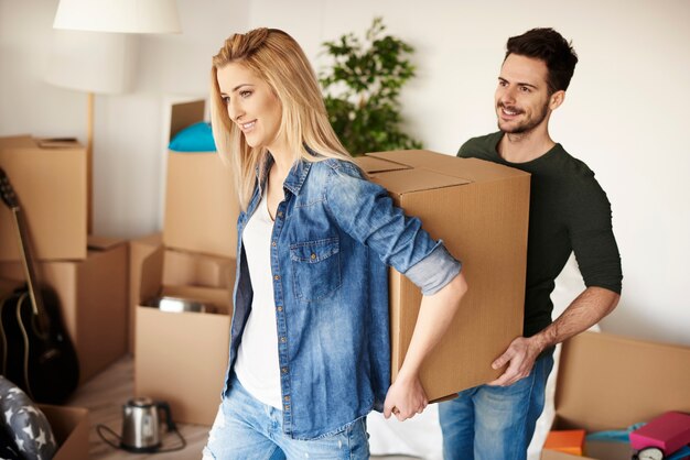 Couple unpacking boxes in their new home