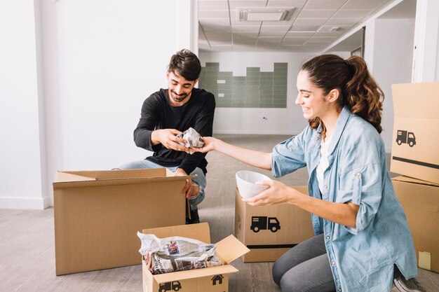 Couple unpacking boxes