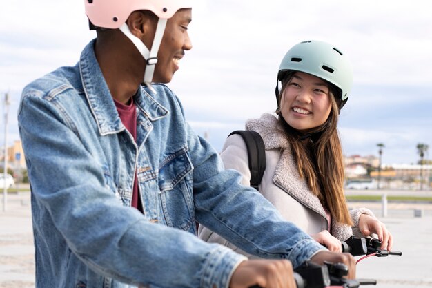Couple using electric scooter for transportation