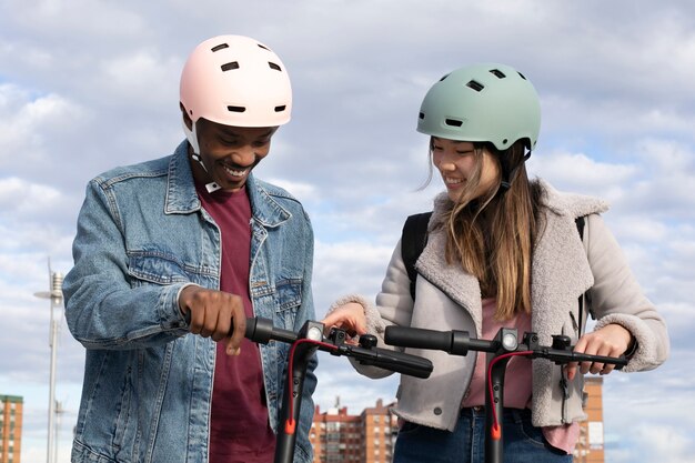 couple using electric scooter for transportation