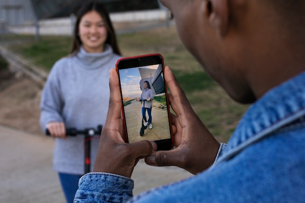 Couple using electric scooter for transportation