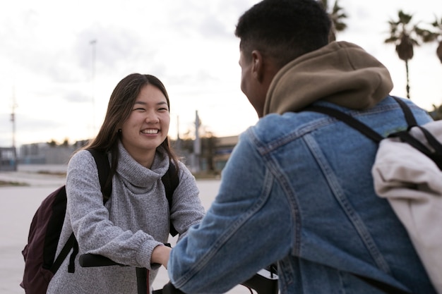 Free photo couple using electric scooter for transportation