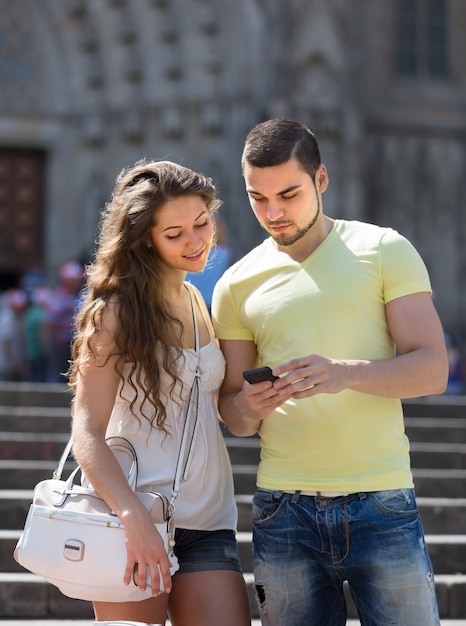 Couple using the map at smartphone