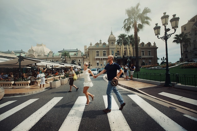 Free Stock Photo: Couple Walking Across Street Holding Hands