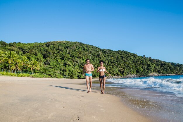 Couple walking along the water