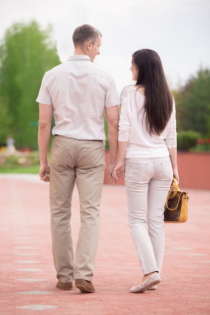 Couple walking hand in hand