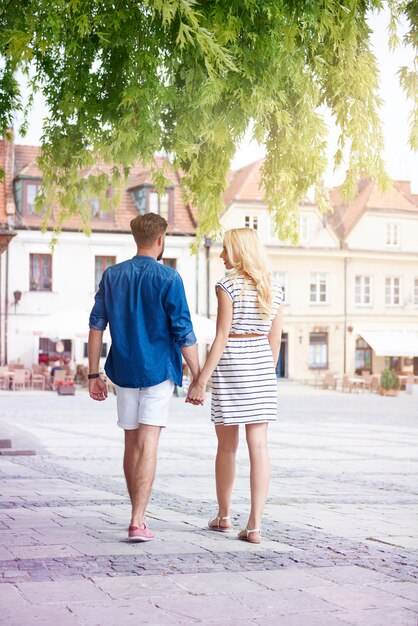 Couple walking at the old town in summer day