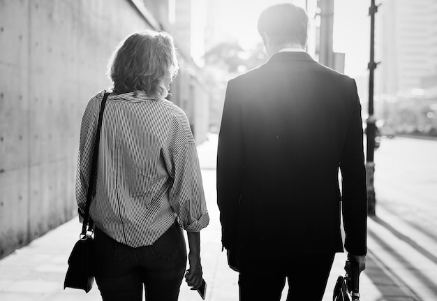 Couple walking on the pavement