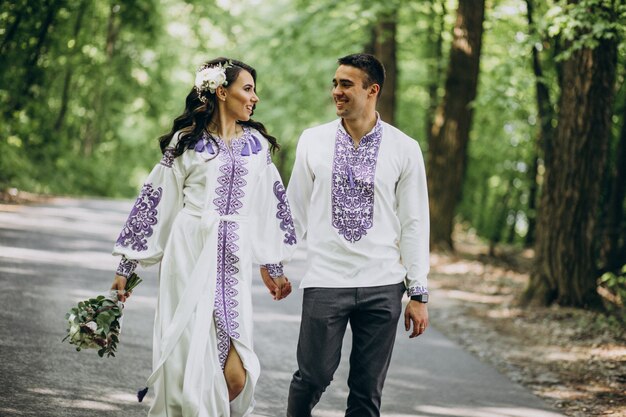 couple walking through the woods