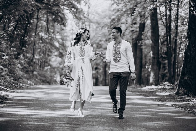 couple walking through the woods