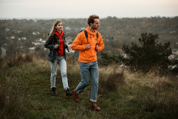 Couple walking while on a road trip together