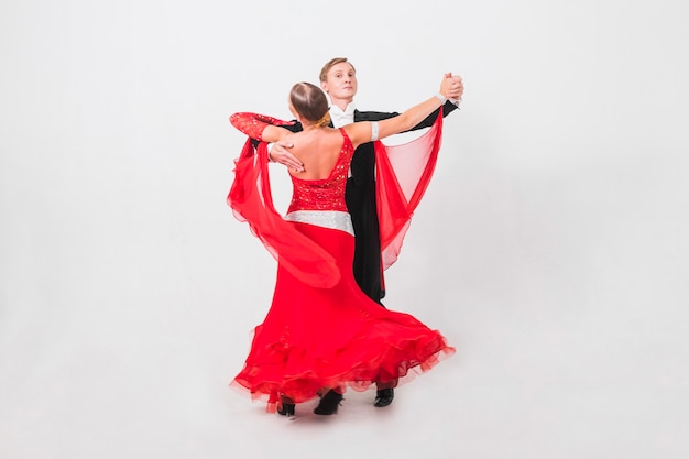 Couple waltzing on white background