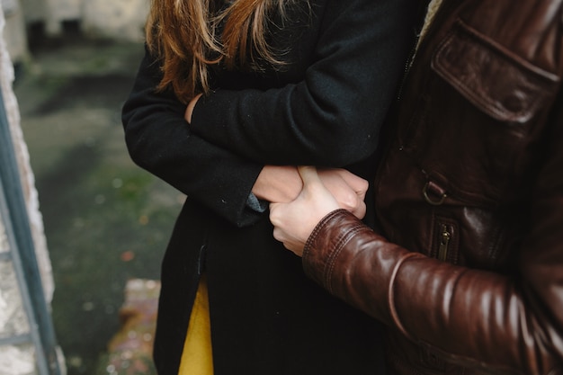 Couple in warm clothes embracing