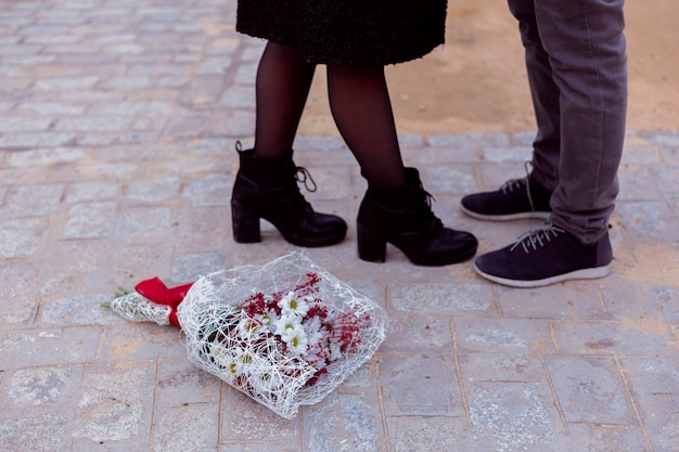 Free photo couple in warm clothes kissing in street