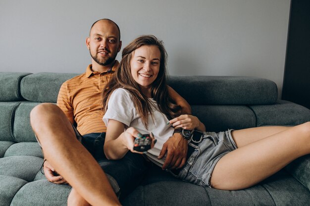 Couple watch tv in a living room