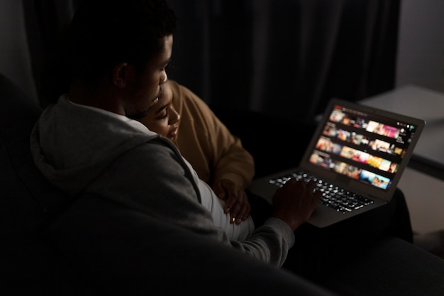 Couple watching streaming service at home