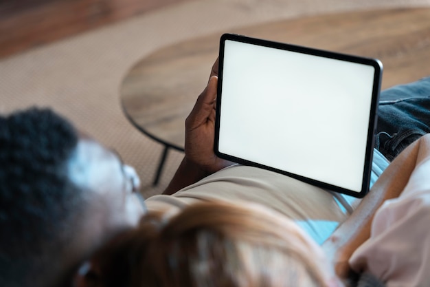 Couple watching streaming service on a tablet