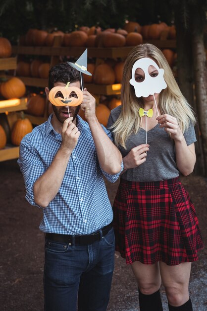 Couple wearing halloween mask