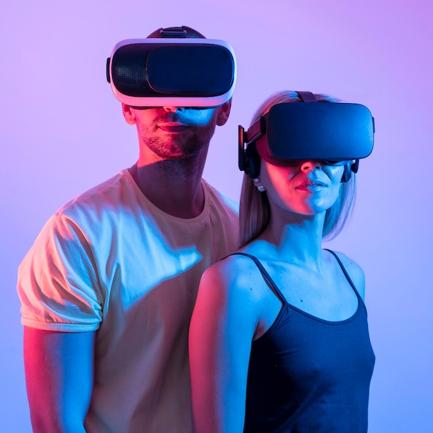 Couple wearing vr glasses medium shot