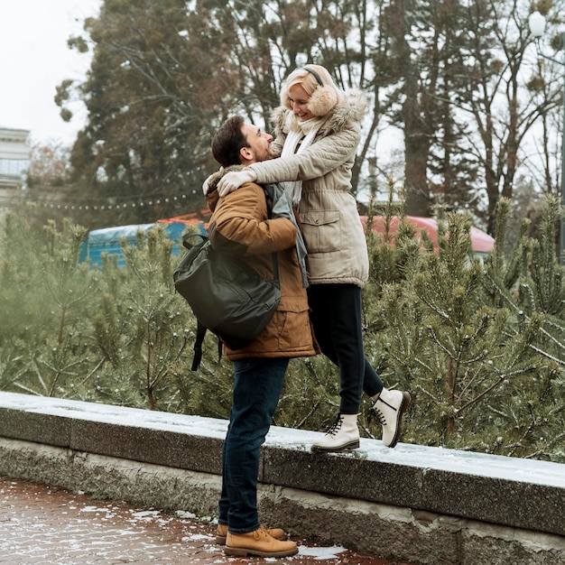 Couple in winter looking at each other