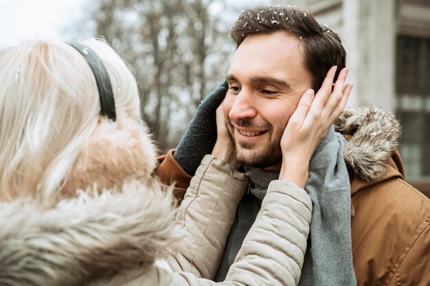 Couple in winter over the shoulder view