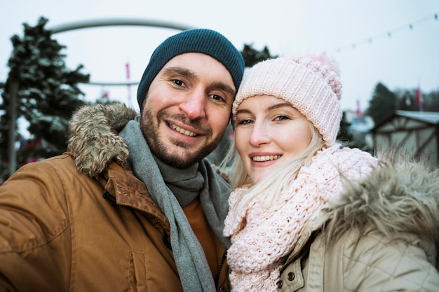 Couple in winter smiling at the camera