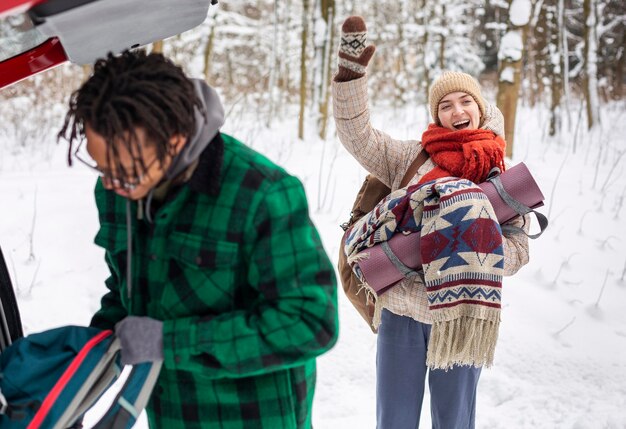 Couple in winter time with backpacks