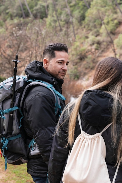 Couple with backpack exploring nature