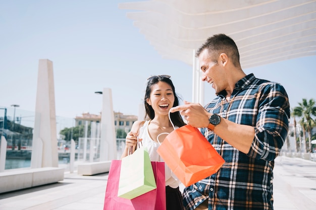 Couple with bags walking outside