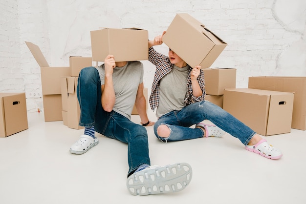 Couple with boxes on heads