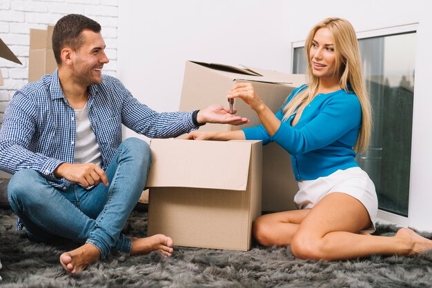 Couple with boxes and keys