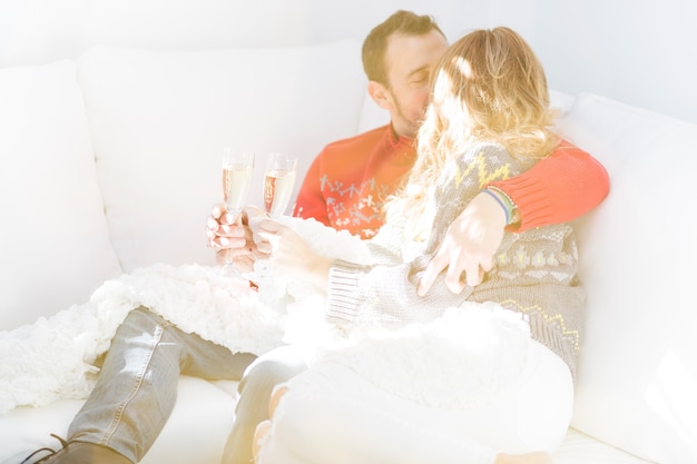 Couple with champagne kissing