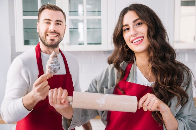 Free photo couple with croissant and pin