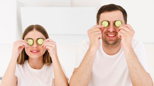 Couple with cucumberg eye mask