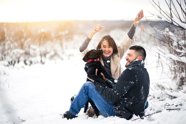 Couple with dog in winter