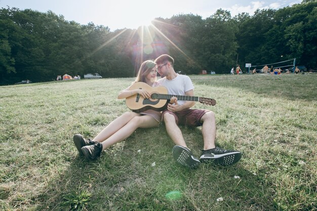 Couple with a guitar front with front