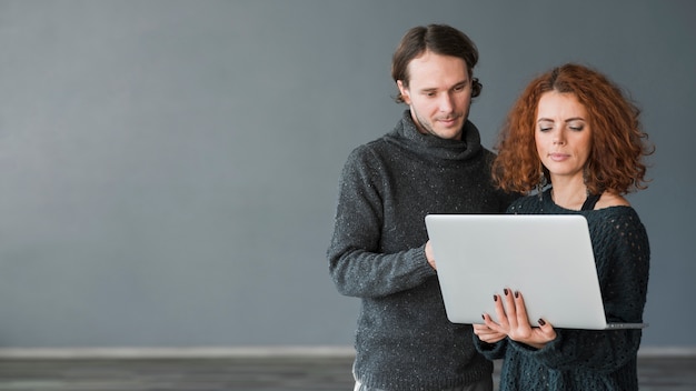 Free photo couple with laptop